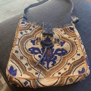A gorgeous beaded Chris Tiana cross body bag.